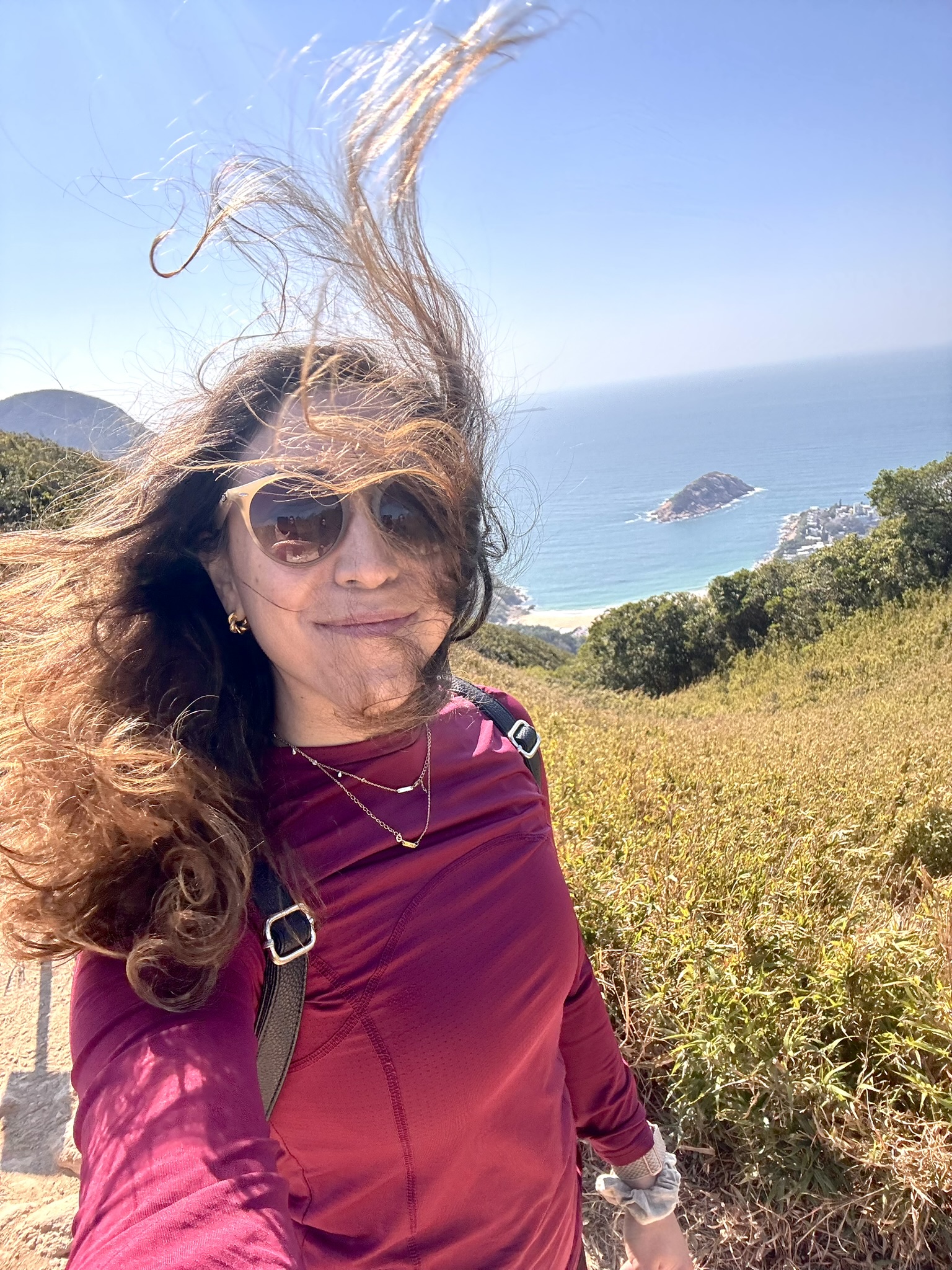 Luisina hiking in Patagonia with turquoise lake